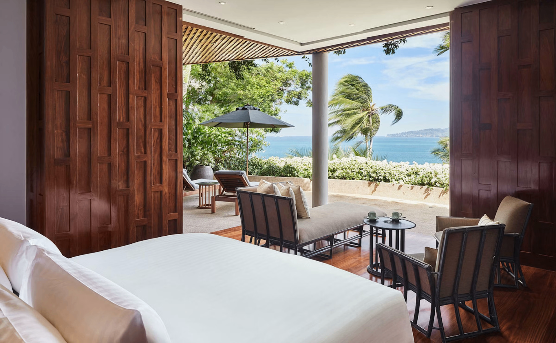A tropical scene in Thailand — infinity pool, villa terrace, or coastal city view